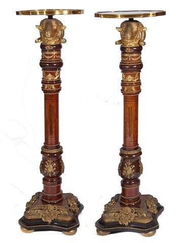 Appraisal: A PAIR OF WALNUT INLAID AND GILT METAL TORCHERES with