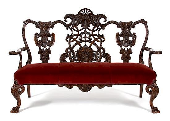 Appraisal: An Irish Chippendale Style Mahogany Settee Height x width x