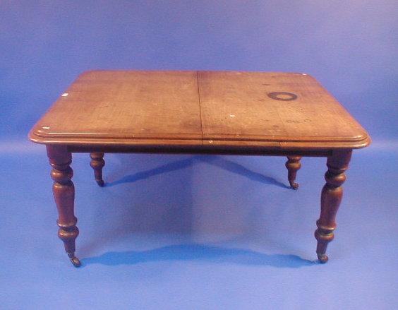 Appraisal: A Victorian mahogany pull-out dining table with moulded top turned