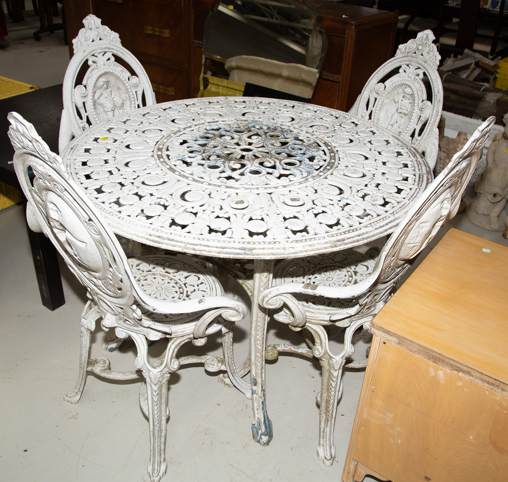 Appraisal: VICTORIAN STYLE GARDEN TABLE CHAIRS Mid th century cast zinc