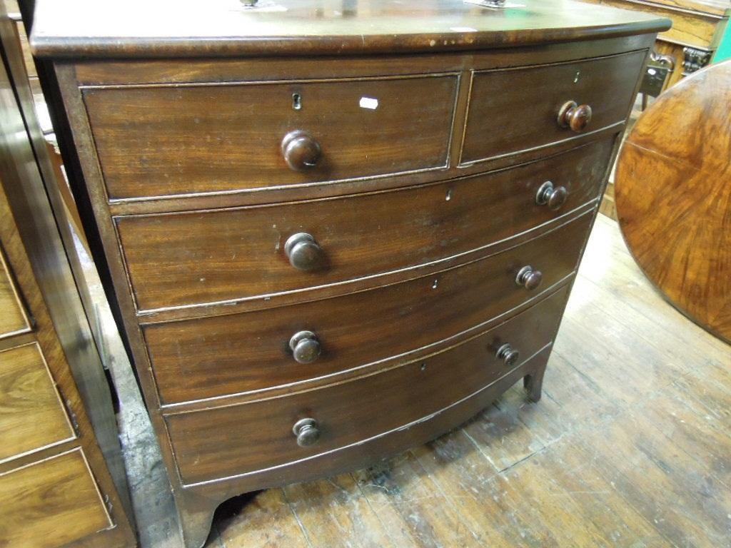 Appraisal: An early th century mahogany bow fronted chest fitted with