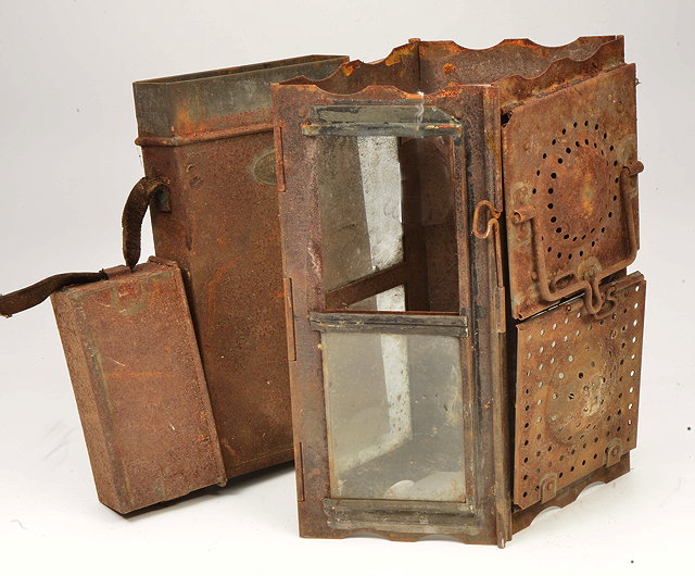 Appraisal: A FOLDING TIN TRENCH CANDLE LANTERN with original case and