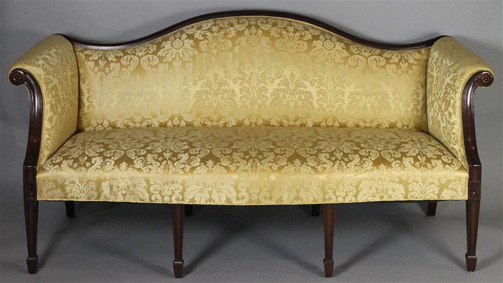 Appraisal: GEORGE III STYLE CARVED MAHOGANY CAMELBACK SOFA with molded toprail