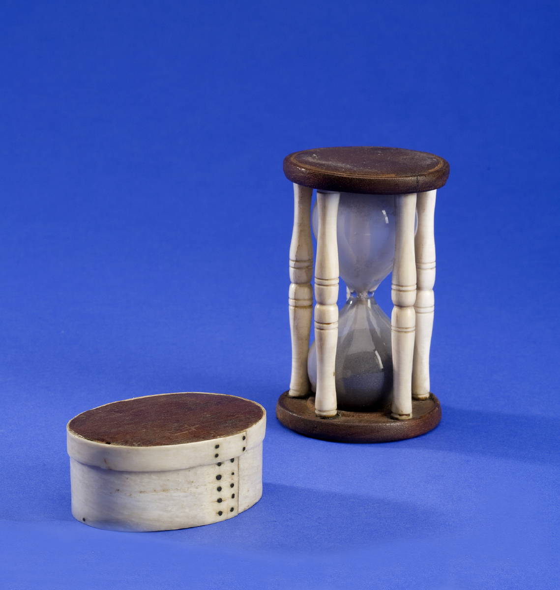 Appraisal: CARVED WHALEBONE AND CHESTNUT TIMING GLASS AND A SMALL WHALEBONE