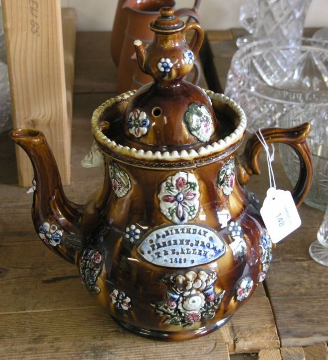 Appraisal: A mid th century Measham bargeware teapot sprigged with flowers