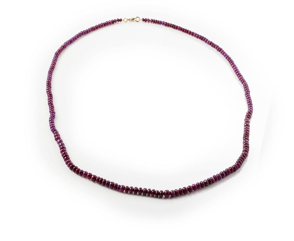 Appraisal: A ruby beaded necklace composed of a single strand of