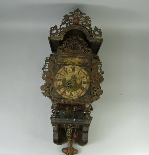 Appraisal: A Dutch hooded wall clock th century the painted wooden