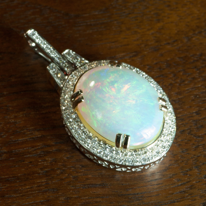 Appraisal: OPAL DIAMOND AND EIGHTEEN KARAT GOLD PENDANT The white gold