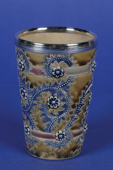 Appraisal: GEORGE TINWORTH A VICTORIAN DOULTON LAMBETH STONEWARE BEAKER decorated overall