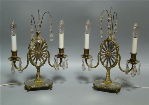 Appraisal: PAIR OF ADAM STYLE TWO-LIGHT SCONCES Each set atop a