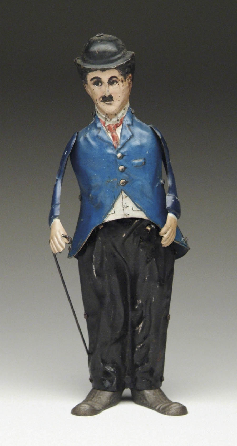 Appraisal: WINDUP WALKING CHARLIE CHAPLIN Lithographed German tin toy with blue