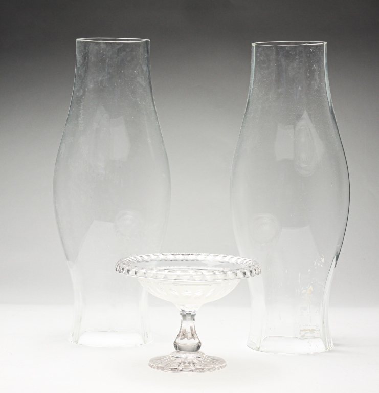 Appraisal: PAIR OF GLASS HURRICANES AND CUT COMPOTE Twentieth century Small