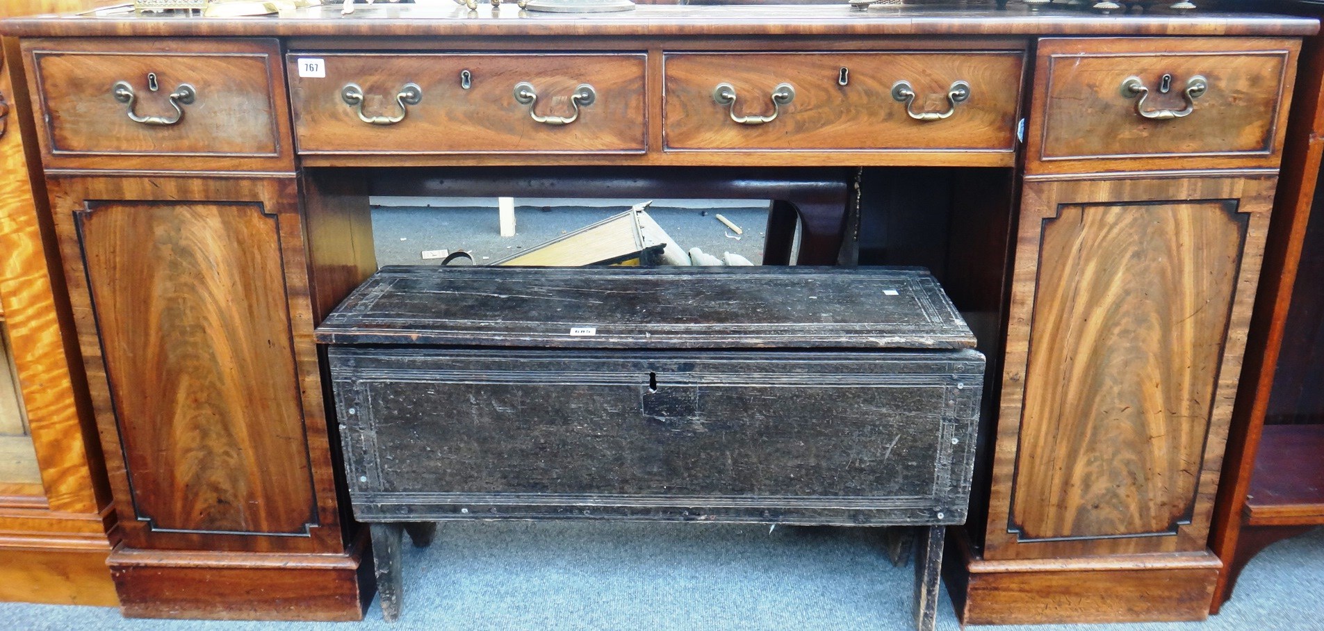 Appraisal: An early th century narrow mahogany sideboard with pair of