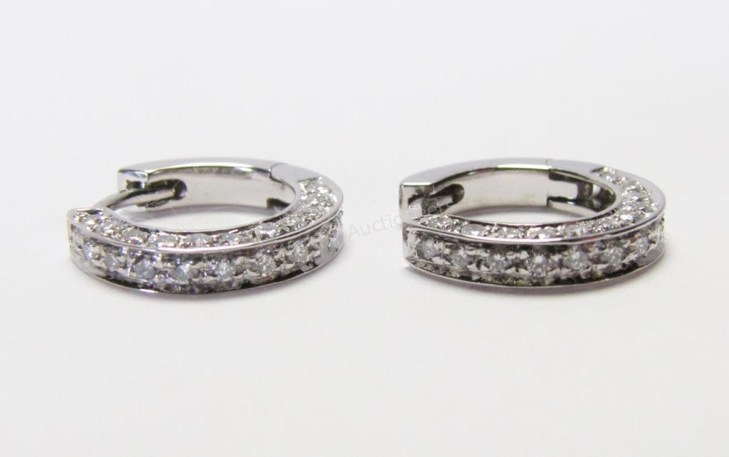 Appraisal: A pair of K white gold three-sided diamond huggie earrings