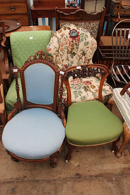 Appraisal: A CARVED WALNUT LOW PARLOUR CHAIR with pierced cresting rail