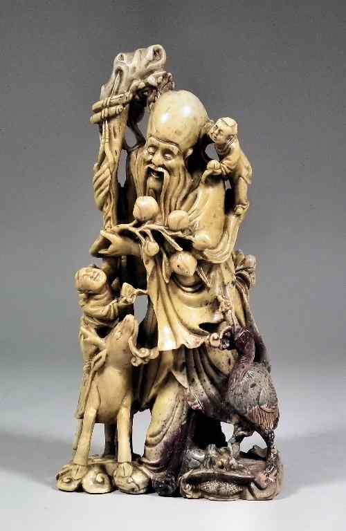 Appraisal: A Chinese carved soapsone steatite figure - Standing figure with