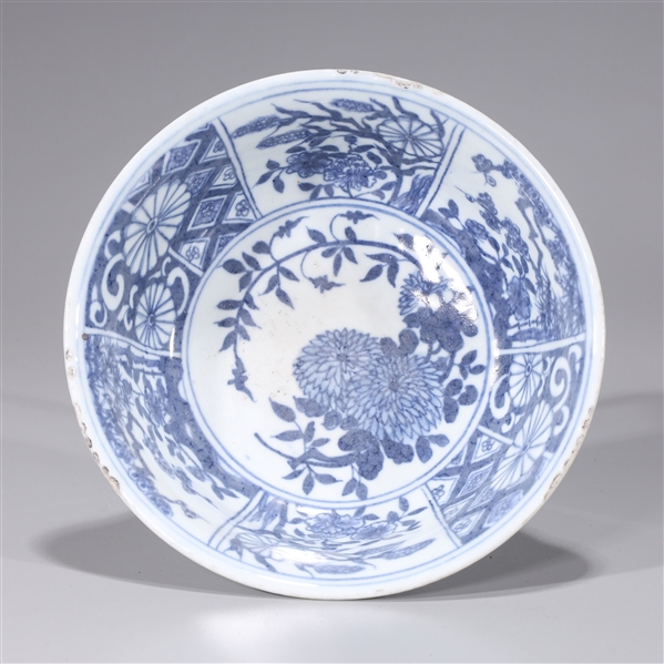 Appraisal: Chinese blue and white porcelain bowl with floral designs to