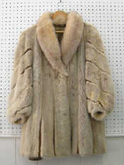 Appraisal: A white mink coat with a slight wear to lining