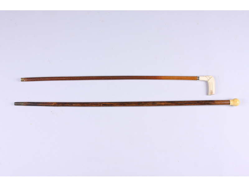 Appraisal: Two Antique Ivory-Handled Canes the first tiger maple sapling with