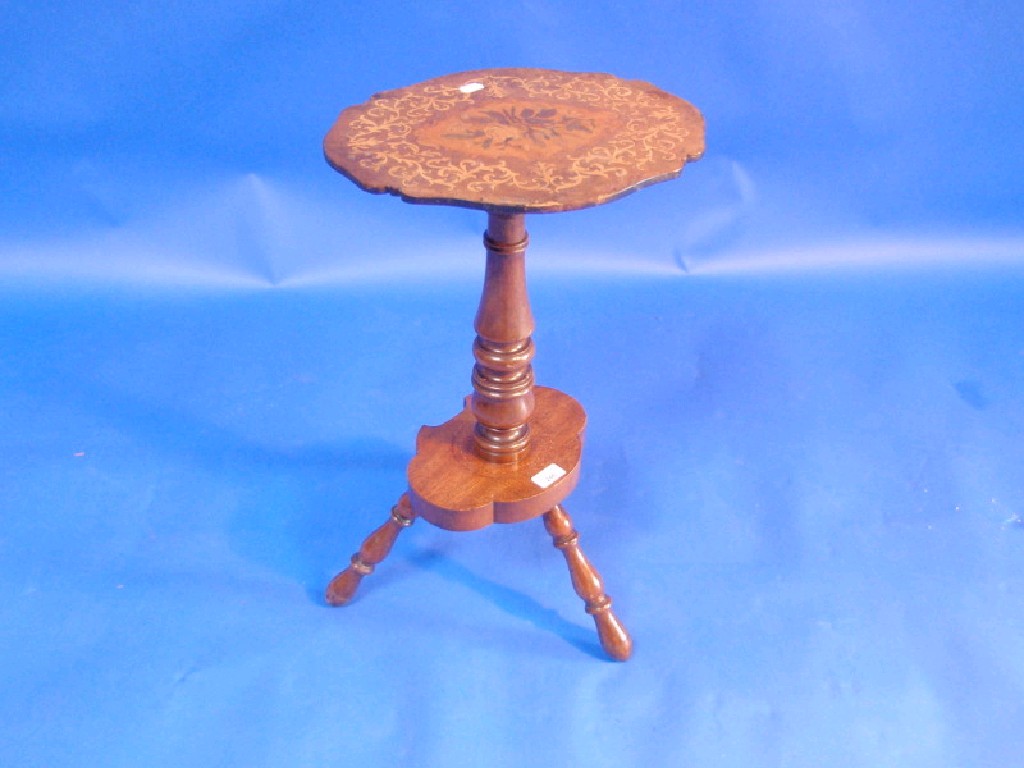 Appraisal: A Victorian mahogany marquetry occasional table with turned pillar shaped