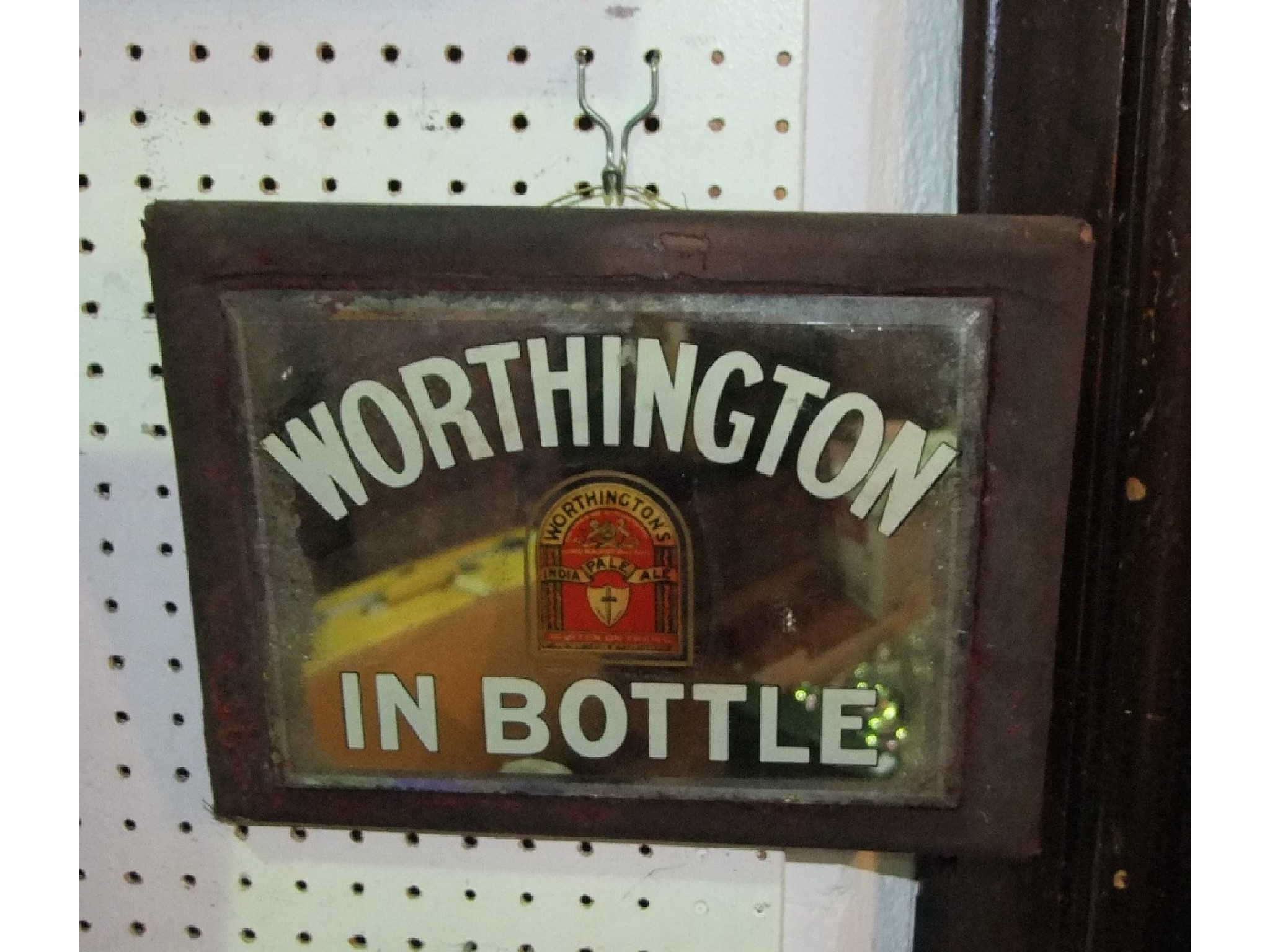 Appraisal: A small early th century advertising mirror for Worthington India