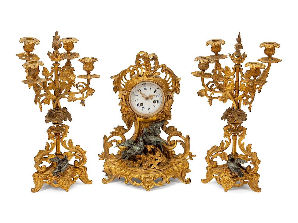 Appraisal: A French Gilt and Patinated Bronze Clock Garniture A French