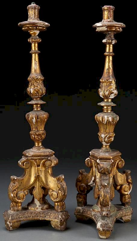 Appraisal: A PAIR OF CARVED GILT WOOD BAROQUE CANDLE STANDS A