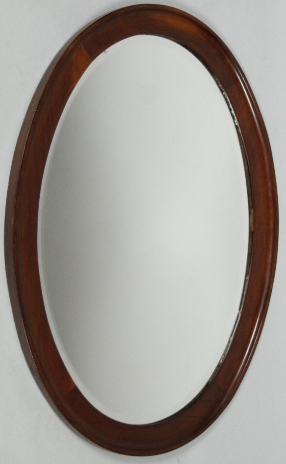 Appraisal: An early thC mahogany framed hanging mirror of oval form