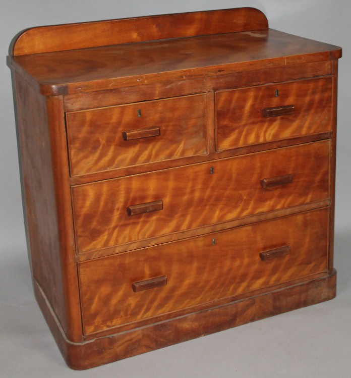 Appraisal: A Victorian satin walnut chest of drawers with a raised