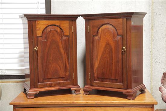 Appraisal: PAIR OF NIGHT STANDS Walnut having arched and paneled doors