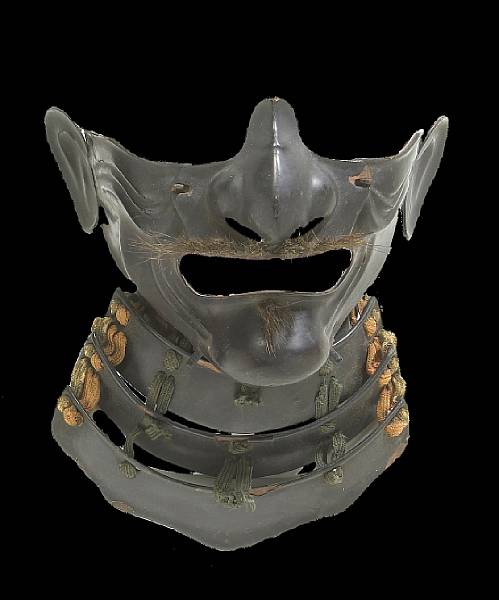 Appraisal: An iron menpo mask Edo Period With black lacquer over