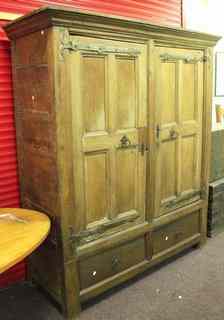 Appraisal: A large th Century style oak wardrobe cupboard with two