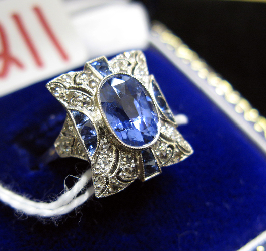 Appraisal: SAPPHIRE DIAMOND AND EITHEEN KARAT WHITE GOLD RING centering a