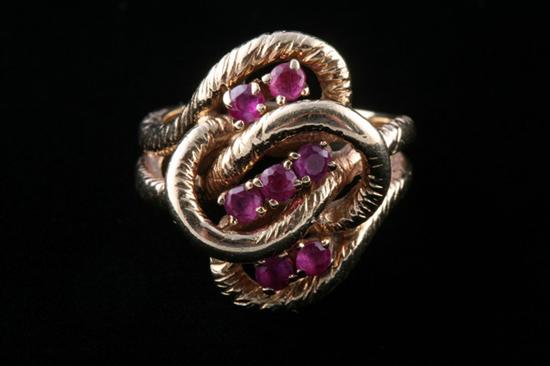 Appraisal: K YELLOW GOLD AND RUBY RING Seven round rubies in