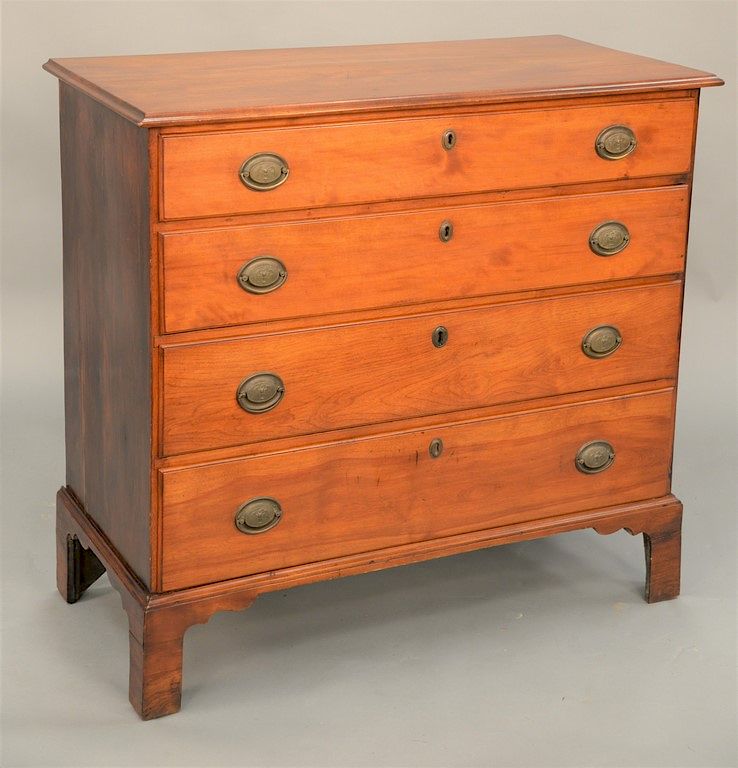 Appraisal: Chippendale chest of four graduated drawers on high bracket feet