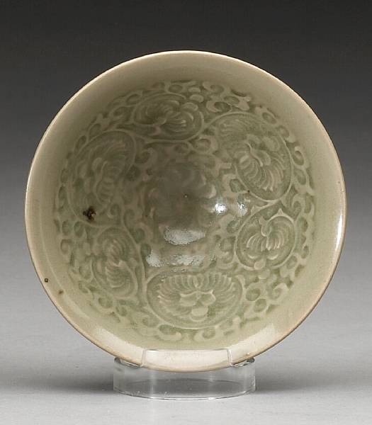 Appraisal: A small Yaozhou celadon glazed conical bowl Northern Song Dynasty