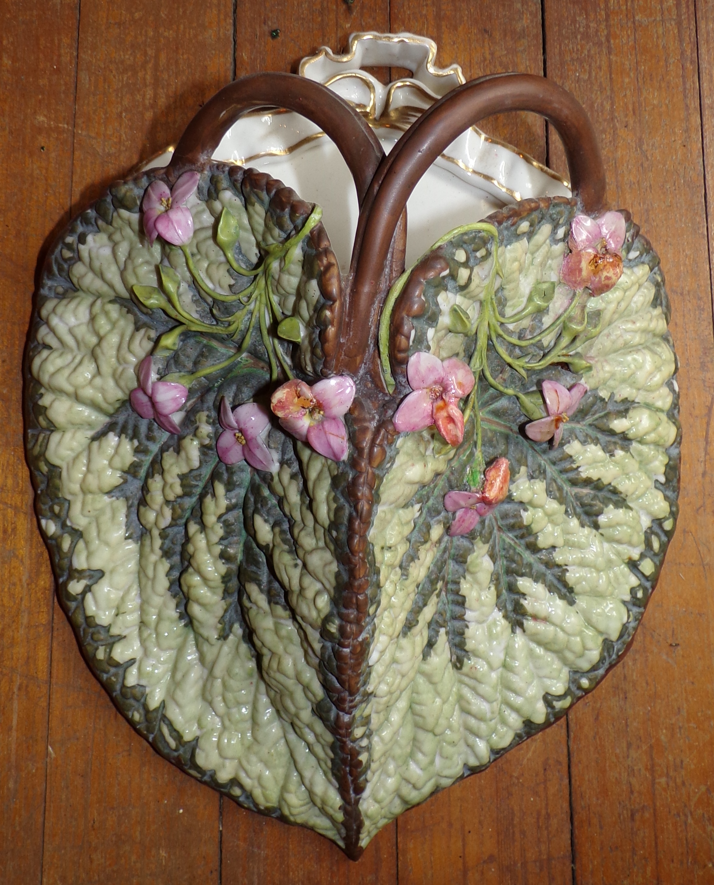 Appraisal: European porcelain Majolica wall pocket- Fern Leaves and Flowers some