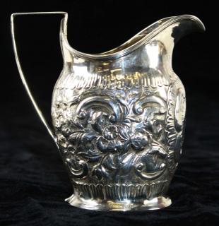 Appraisal: English silver creamer by Andrew Fogelberg London Floral repousse probably