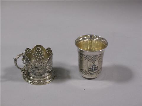 Appraisal: TURKISH SILVER CUP HOLDER AND SMALL BEAKER The cup holder