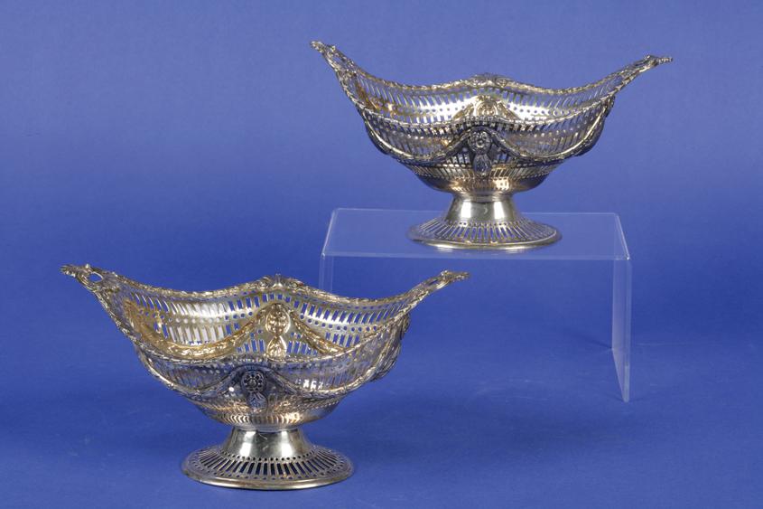 Appraisal: A PAIR OF EDWARDIAN SWEETMEAT DISHES of shaped oval form