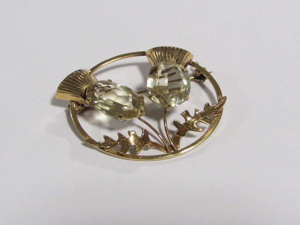 Appraisal: A nine carat gold open circular thistle decorated brooch set