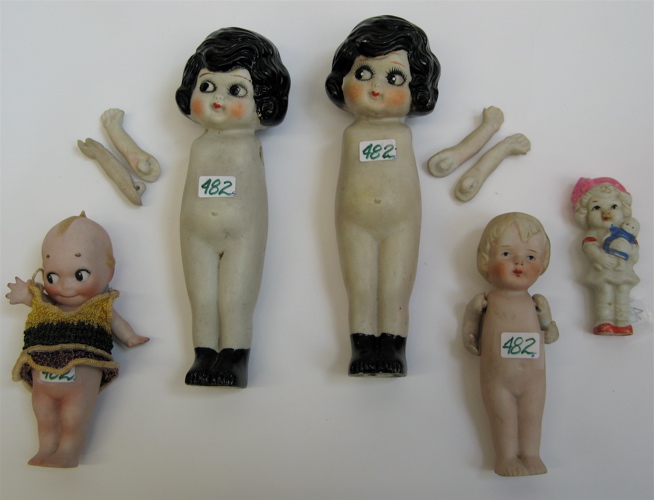 Appraisal: GROUP OF ALL BISQUE MINIATURE DOLLS One is a Kewpie