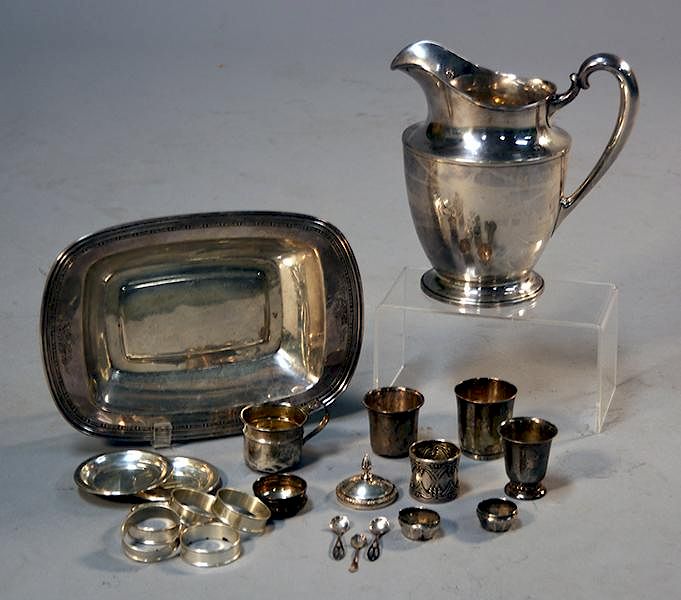 Appraisal: Sterling water pitcher with two sterling bowls napkin rings and