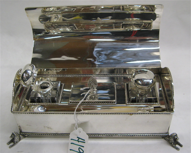 Appraisal: ENGLISH SILVER PLATED INKSTAND The curved lid opens to reveal