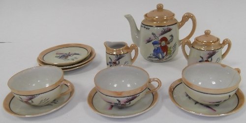 Appraisal: A dolls' Continental tea service of fourteen pieces 'Here We