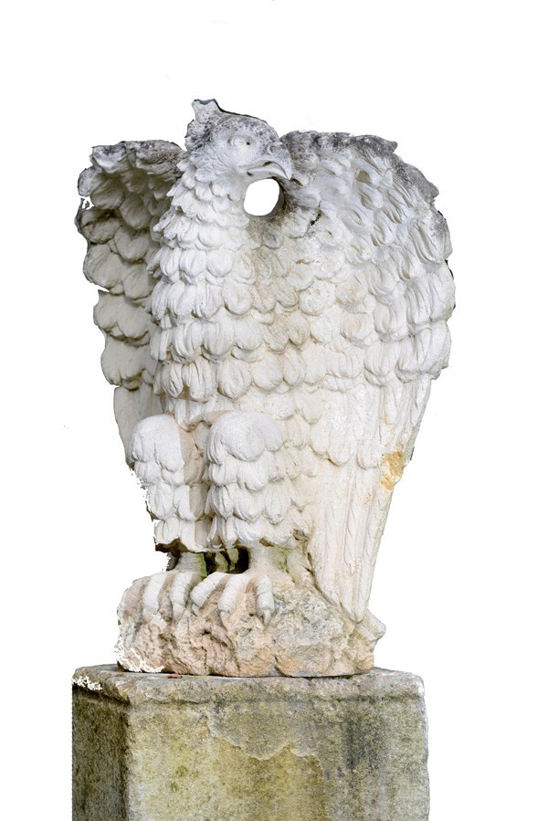 Appraisal: A carved limestone eagle on square base cm high Illustrated