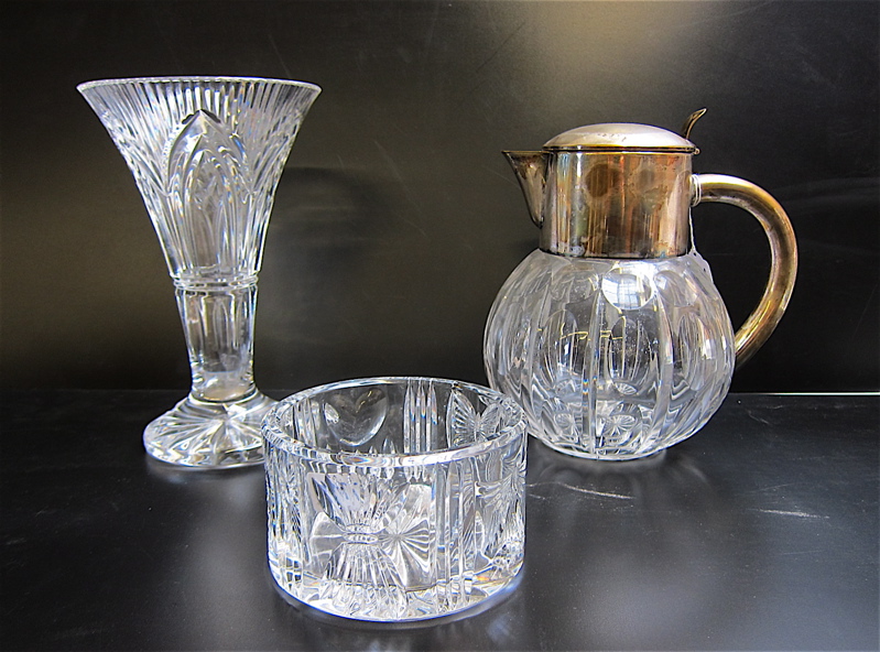 Appraisal: THREE CUT CRYSTAL TABLEWARE PIECES German water pitcher with silver