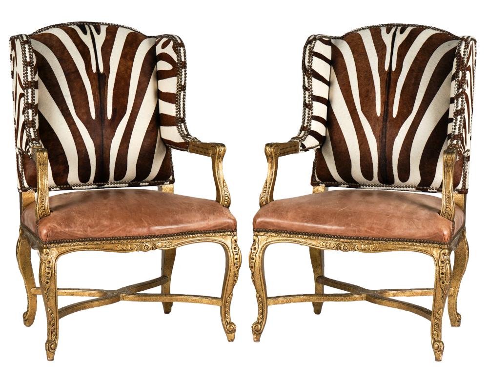 Appraisal: PAIR OF RALPH LAUREN WING CHAIRSgiltwood leather and printed cowhide