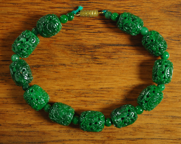 Appraisal: MOSS GREEN JADE BARREL BEAD BRACELET length inches