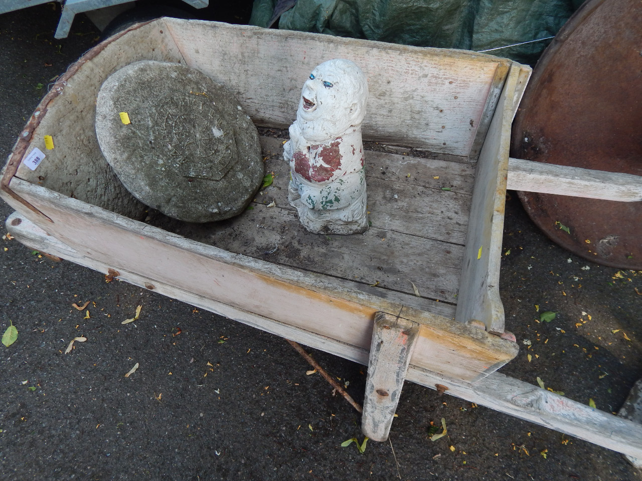 Appraisal: A Victorian wooden wheelbarrow with later pneumatic tyre total length